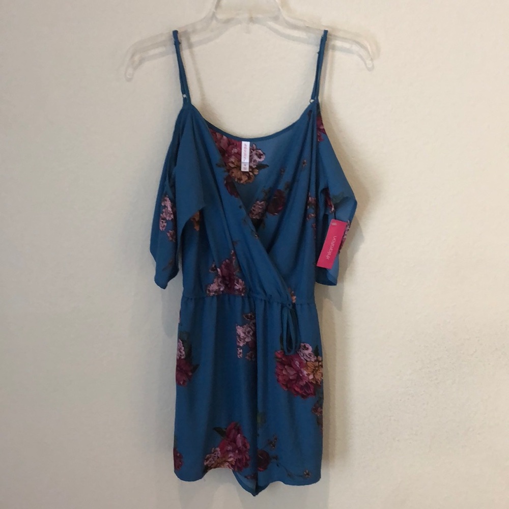 V-neck, strappy blue floral romper with pockets